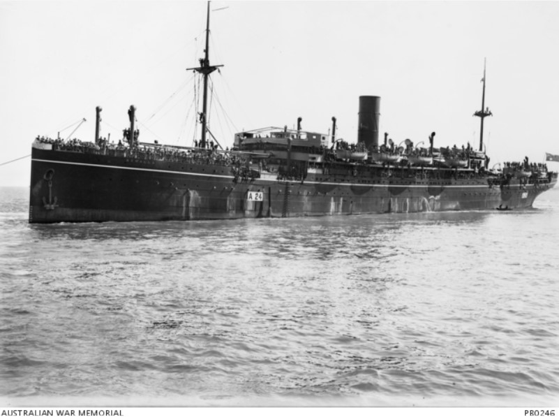 Troop transport HMAT Benalla (A24), crowded with troops, departing from the wharf.